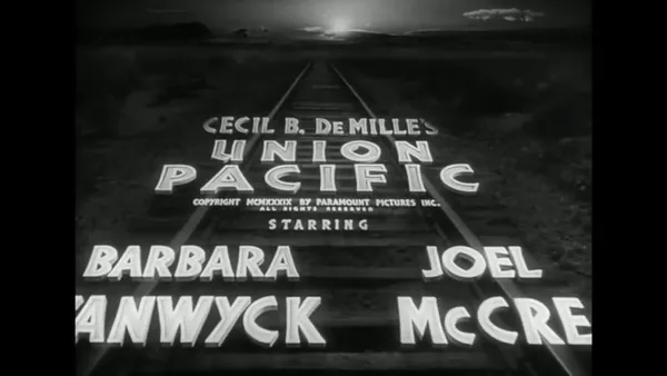 union pacfic title card. it shows the title travelling up a railway track. The title says: cecil b demilles union pacific.