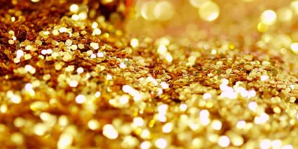 A large pile of golden glitter flakes.